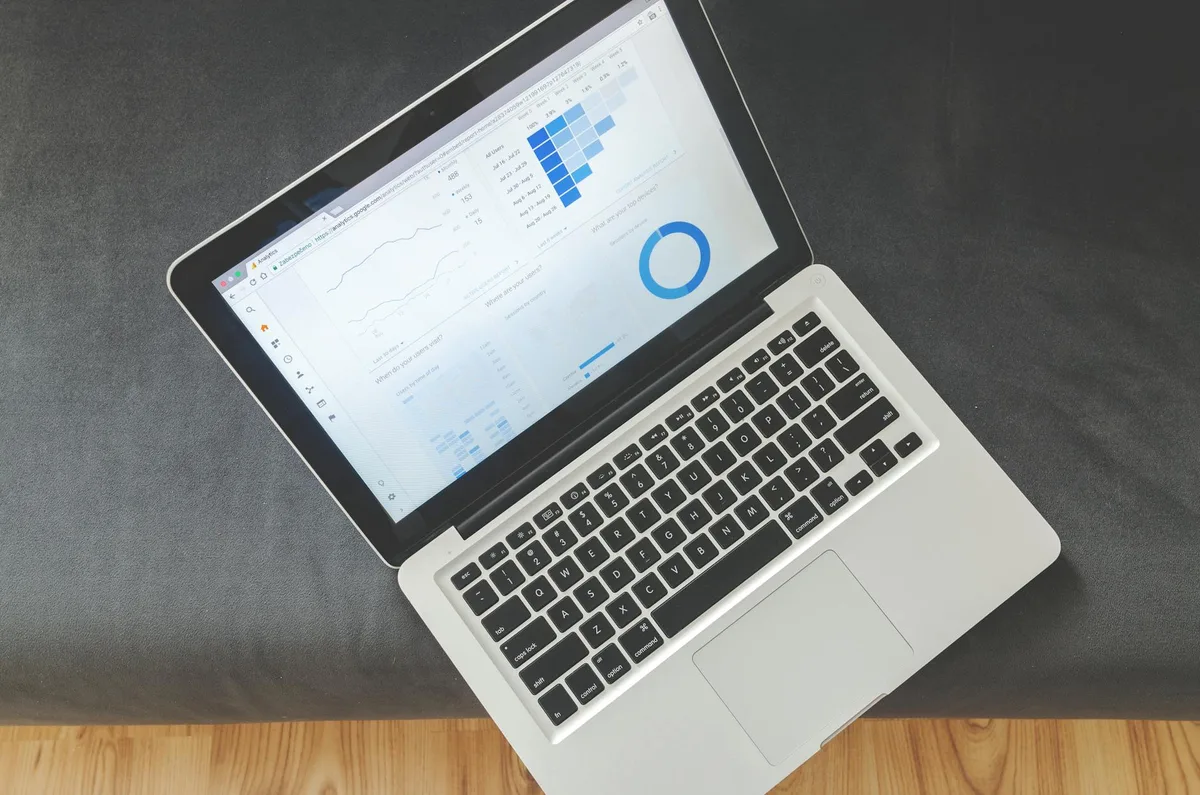 Philippine ecommerce seller managing online store orders and tracking SEO performance on a laptop in a home office
