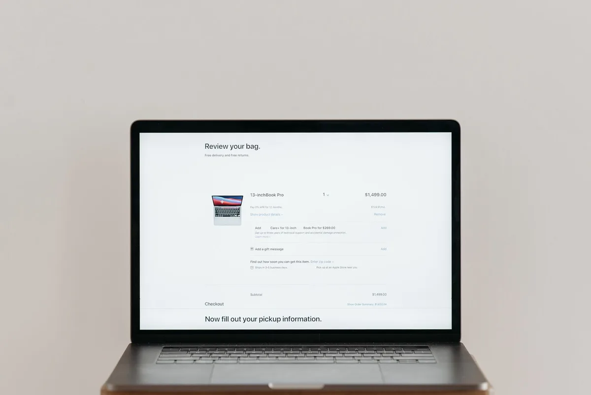 Laptop showing an online checkout screen, representing an abandoned cart at the payment step