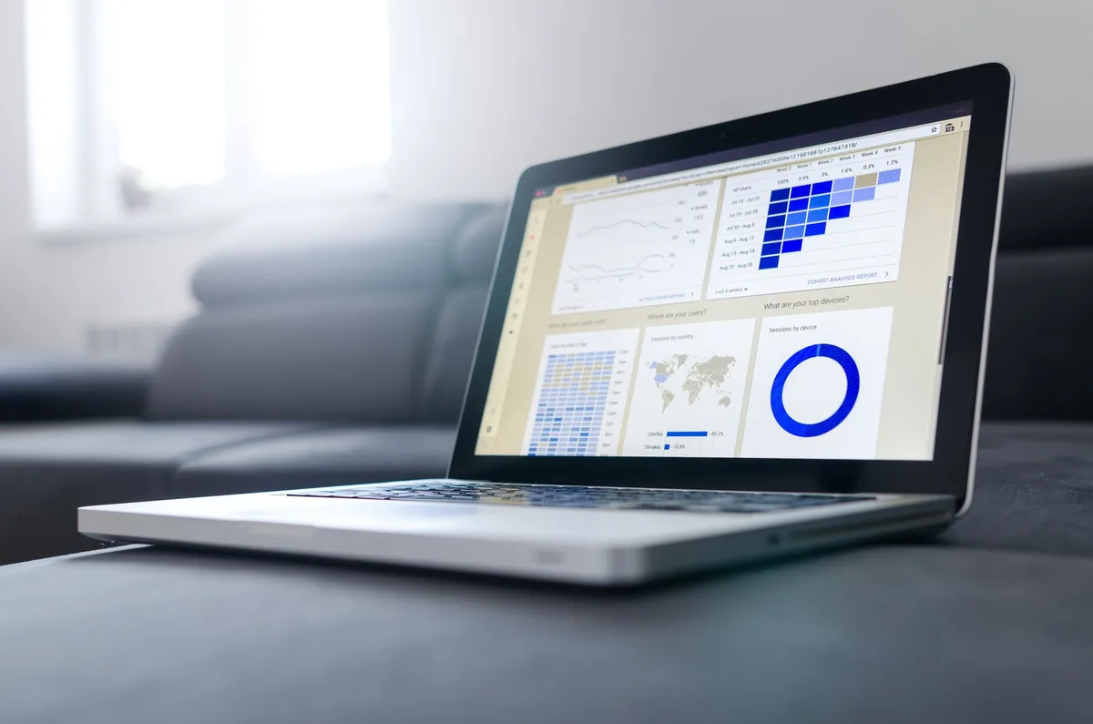 Laptop screen displaying ecommerce analytics dashboard with sales performance data for a Philippine online seller
