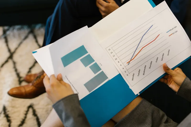 Business reports with graphs and data charts representing SEO keyword research and performance analysis for UAE ecommerce