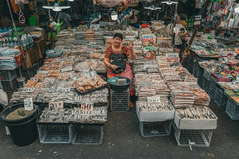 TikTok LIVE ecommerce stream showing pinned product cards, viewer comments, and real-time purchase metrics during a Philippine live selling session