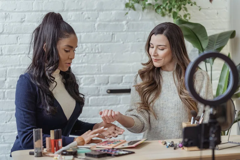 Female content creators recording makeup tutorial videos for TikTok Shop affiliate program